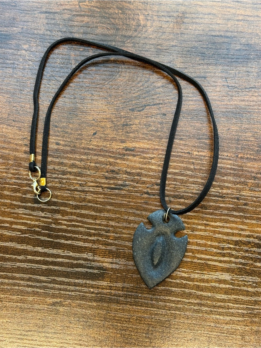 Handmade Dark Gray Granite Stone Arrowhead Pendant on Black Suede Cord